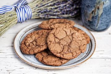 Plate of chocolate cookies on rustic table