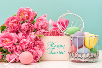 Tulip flowers and pastel colored easter eggs. Greetings card