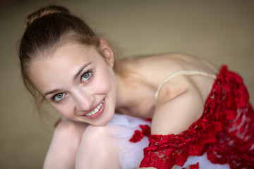 Naklejka premium Portrait of a young ballerina with a beautiful smile. The model
