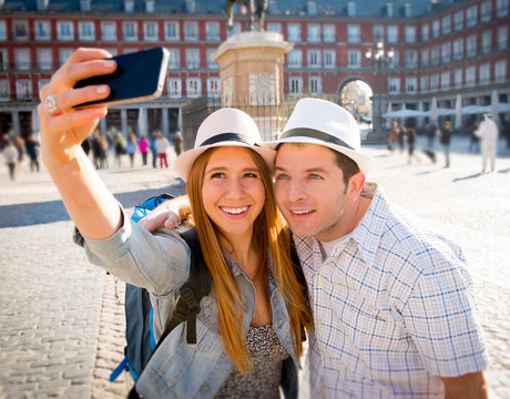 friends tourist couple visiting Europe in holidays taking selfie