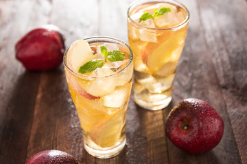 apple juice and apples on wooden table