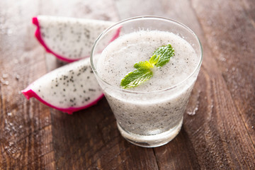 Dragon fruit smoothie on wooden table