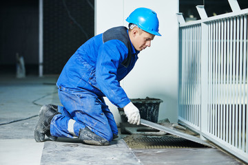 tiler at industrial floor tiling renovation
