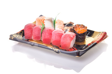 Nigiri sushi in hand with soya sauce on White Isolated background