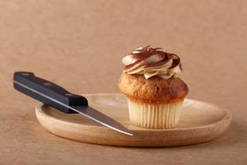 cupcake on plate with knife