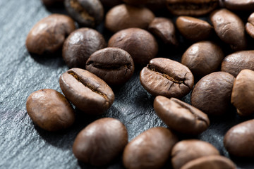 coffee beans on a dark background, selective focus, close-up