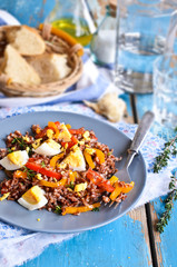 Salad of red rice, paprika and eggs