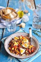 Salad of red rice, paprika and eggs