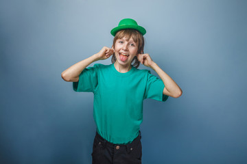 European-looking boy of ten years smiley shows the language in a