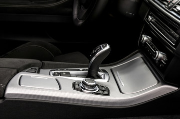 Automatic transmission gear shift. Modern car interior detail.