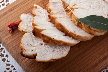 Roasted turkey breast on wooden plank