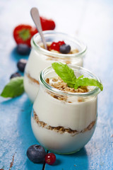 Healthy breakfast - yogurt with muesli and berries