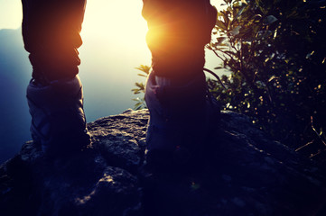 hiking legs sunrise mountain peak