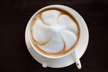 Cappuccino coffee cup with white spoon