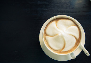 Cappuccino coffee cup with white spoon