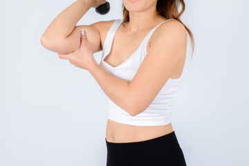 Fototapeta premium Woman doing fitness exercise with a hand weights.