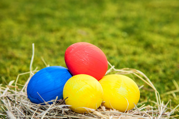 Easter eggs lying in straw