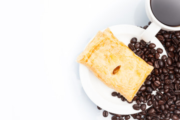 Cup of coffee with Pie on beans.