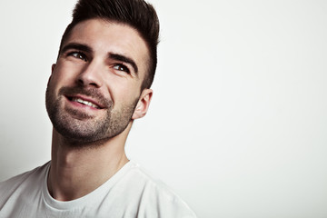 Fototapeta premium portrait of young smiling handsome man