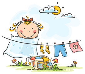 Fototapeta premium Little girl helping her mother with the laundry