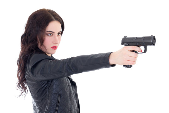young beautiful woman shooting with gun isolated on white