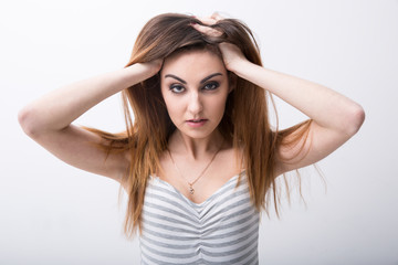 Obraz premium sexy woman sitting on the floor and looking at camera