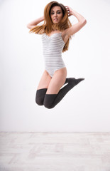 Portrait of a beautiful fit woman jumping