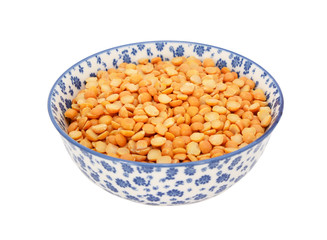 Yellow split peas in a blue and white china bowl