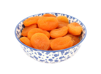 Dried apricots in a blue and white china bowl