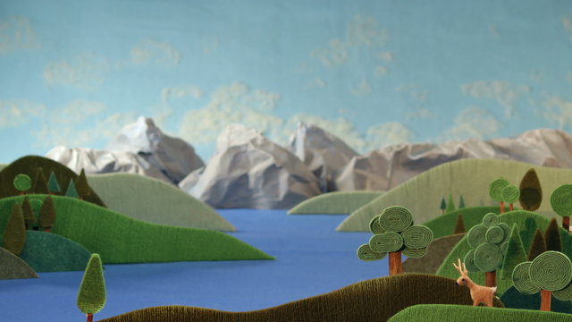 Mountains panorama with deer - animation