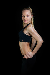Athletic young woman showing trained beautiful body