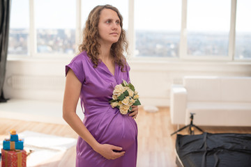 long-haired pretty pregnant woman