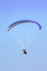 Paramotor in the blue sky