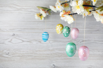 Eggs hanging on a branch