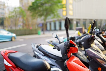 Fototapeten Motorbikes parked on the street of Macau © efired