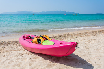 Colorful kayak on tropical beach