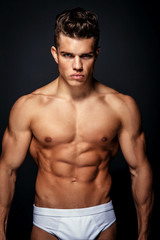 Fototapeta na wymiar Awesome male model with muscular torso.