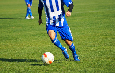 Soccer player with a ball © majorosl66