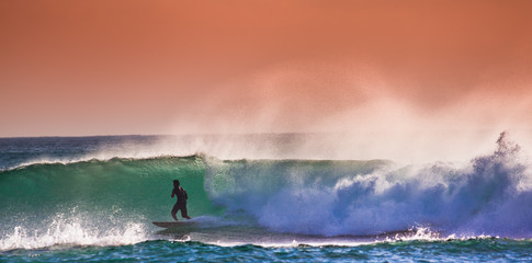 Surfer on Blue Ocean Wave in Bali