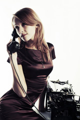 Fototapeta na wymiar Young fashion woman calling on retro phone