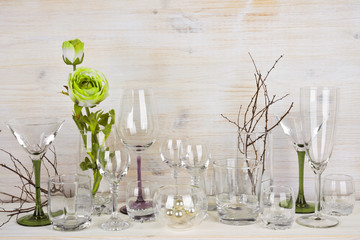 Collection of various glassware on wooden background