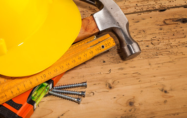 yellow helmet and wood mounting tools