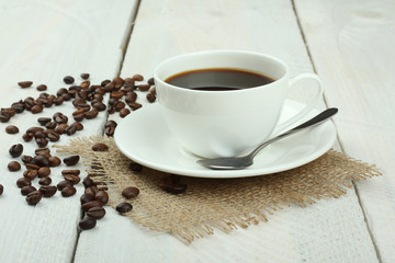 cup of coffee on a wooden background