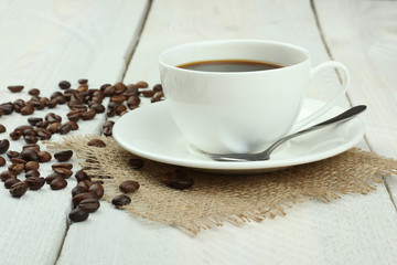 cup of coffee on a wooden background