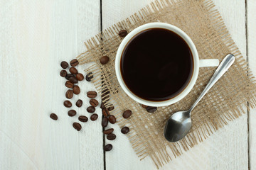 cup of coffee on a wooden background