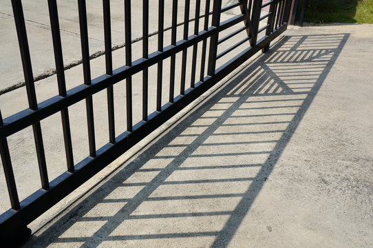metal fence shadow cement ground concept