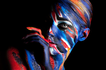 girl in a bright colored paint body art