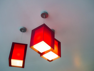 Three hanging lights in an apartment