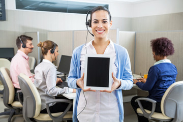 Happy Customer Service Representative Showing Tablet Computer