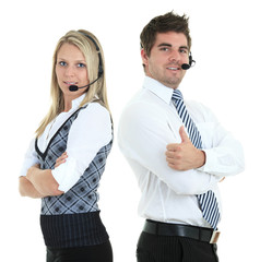Young employee working with a headset and accompanied by his